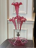 Full view of epergne showing central vase and three surrounding vases set into bowl