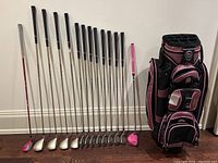 All clubs and bag arranged upright against wall