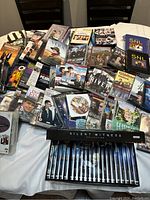 Overview of all DVD cases laid out on a table