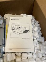 Pitney Bowes print machine user manual titled 'Plieuse Modele 1810' showing an illustration of the print machine.