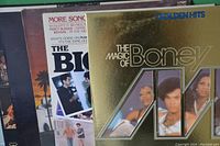 Close-up showing album covers for The Big Chill, The Magic of Boney M, and McCluskey A Long Time Coming albums.