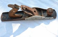 Side view of the Bailey No. 5 wood planer showing metal body, wooden front knob and rear handle