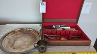 Electroplated silverware set on table including tray, mug, and wooden box with cutlery
