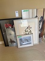 Group shot of all five framed prints leaning against wall