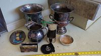 Overview photo of all silverware and related items showing their condition and variety.