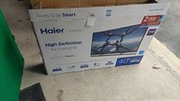 Haier 40D3505 TV original box showing model and specs including 40 inch LED HDTV, Full HD 1080p, Smart TV.