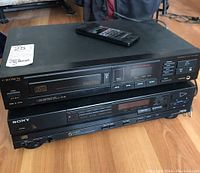 Both Crown CD-80 and Sony CDP-C5F CD players stacked with remote on top