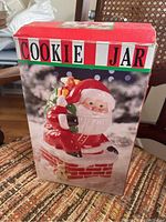 Photo of the original box showing the front image of the Santa Claus cookie jar and the text 'COOKIE JAR'.