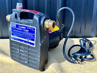Front view of Gorman-Rupp 80 Series Handy Pump showing intake and outtake brass fittings and power cord