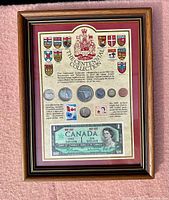 Full view of framed 1967 Canadian Centennial Collection including coins, stamps, banknote, and provincial shields.