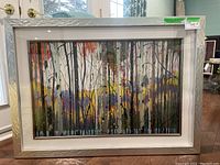 Full view of the framed colorful birch trees art print with silver metal frame, showing the entire artwork and frame dimensions.