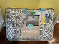 Full packaged set with clear packaging showing pattern and handle, label showing brand and design, includes 3-piece set.