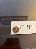 Obverse of 1858 American Flying Eagle Penny showing the flying eagle design with moderate wear.