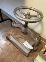 Front perspective view of entire press showing handwheel, frame and base plate