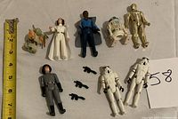 Overview of all figures and accessories laid out on surface