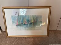 Framed sailboat painting by Sibylle Rett, approximately 24x17 inches, showing multiple colorful sailboats on water.