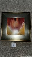 Front view of framed painting showing abstract warm color artwork signed by G. Feenstra