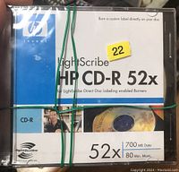 Photo of sealed HP Invent LightScribe CD-R 52x disc with information about burning custom labels and data capacity