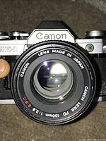 Front view of camera and attached lens