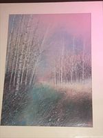 Full view of landscape painting showing pastel colors and birch trees with white mat and dark frame.