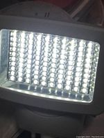 Close-up image of the outdoor LED light showing multiple LED bulbs lit up