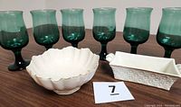 Set of six green tulip-shaped glasses with dark green gradient and gold rims, displayed with two Lenox fine china bowls.