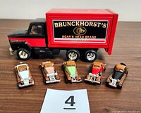 Front view showing Brunckhorsts Boars Head truck and five Hot Wheels touring cars lined up