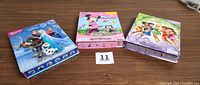Three boxed sets: Frozen, Minnie Mouse, and Tinker Bell My Busy Books sets.