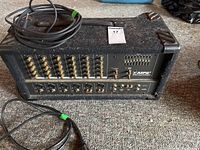 Front view of mixer with cables on top, showing overall layout and carpeted enclosure