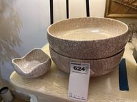 Photo shows two large round bowls stacked and one smaller square bowl, crackle glaze finish