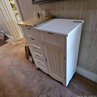 Image showing the cabinet from a frontal angle, highlighting the four drawers and side door.