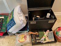 Singer sewing machine in case with white thread spool