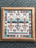 Framed Native American Navajo sand painting showing full artwork and frame.