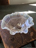 Top and interior view of opalescent glass bowl with intricate Celtic design and scalloped edges