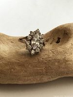 Front view showing marquise center crystal surrounded by smaller round crystals set in sterling silver.