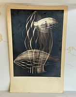 Full view of vintage signed print artwork depicting abstract forms in grayscale tones.