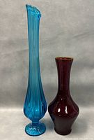Photo showing front view of both vases side by side on a neutral background.