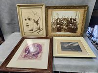 Four vintage framed original photos arranged on a surface, showing the variety of subjects and frame styles.