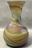 Front angled view of the vase showing its shape and marbled coloration.