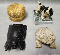 Top view of figurines and decorative box showing material and carving details