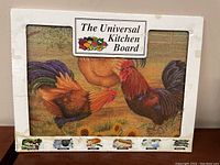 Boxed glass cutting board with painted rooster and hen scene