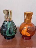 Front view of both Lampe Berger Paris catalytic glass diffusers.