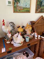 Three-piece Fitz & Floyd white ceramic rooster set displayed together