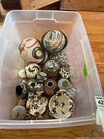 All pottery pieces in plastic bin
