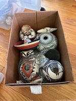 Top-down view of all ceramics and basket inside a cardboard box