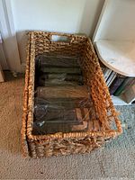 Wicker basket with books wrapped in plastic