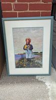 Framed art print titled 'Anne Of Green Gables - Beyond Summer Fields' by Ben Stahl, showing a girl in a blue dress holding flowers with a scenic background.
