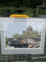Full view of the framed Tintin in Quebec City print showing the historic walls with cannons and Chateau Frontenac in the background.