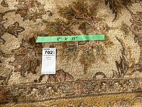 Photo showing measurement tape indicating 8' x 11' dimensions and MaxSold lot tag