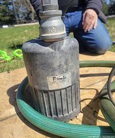 Close-up of the Flotec submersible pump showing the brand label and hose fitting.